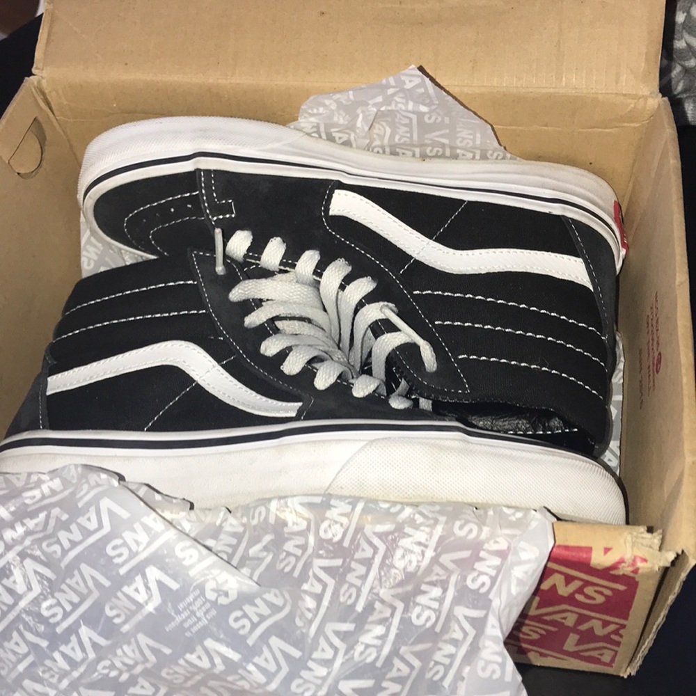 Black and white high top vans